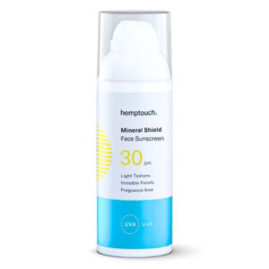 Une bouteille de Hemptouch - Écran Solaire Minéral Visage SPF 30 (50 ml), présentant un design blanc et bleu. L'étiquette met en avant une texture légère, un fini invisible et une formule sans parfum.