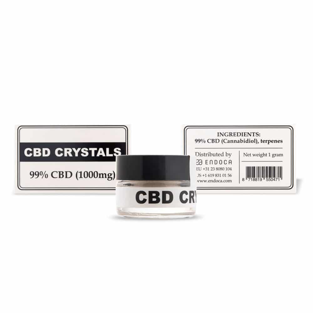 une bouteille de cristaux de cbd à côté d'une boîte de cristaux de cbd.