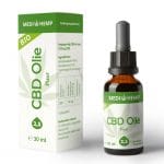 une bouteille d'huile de CBD à côté d'une boîte.